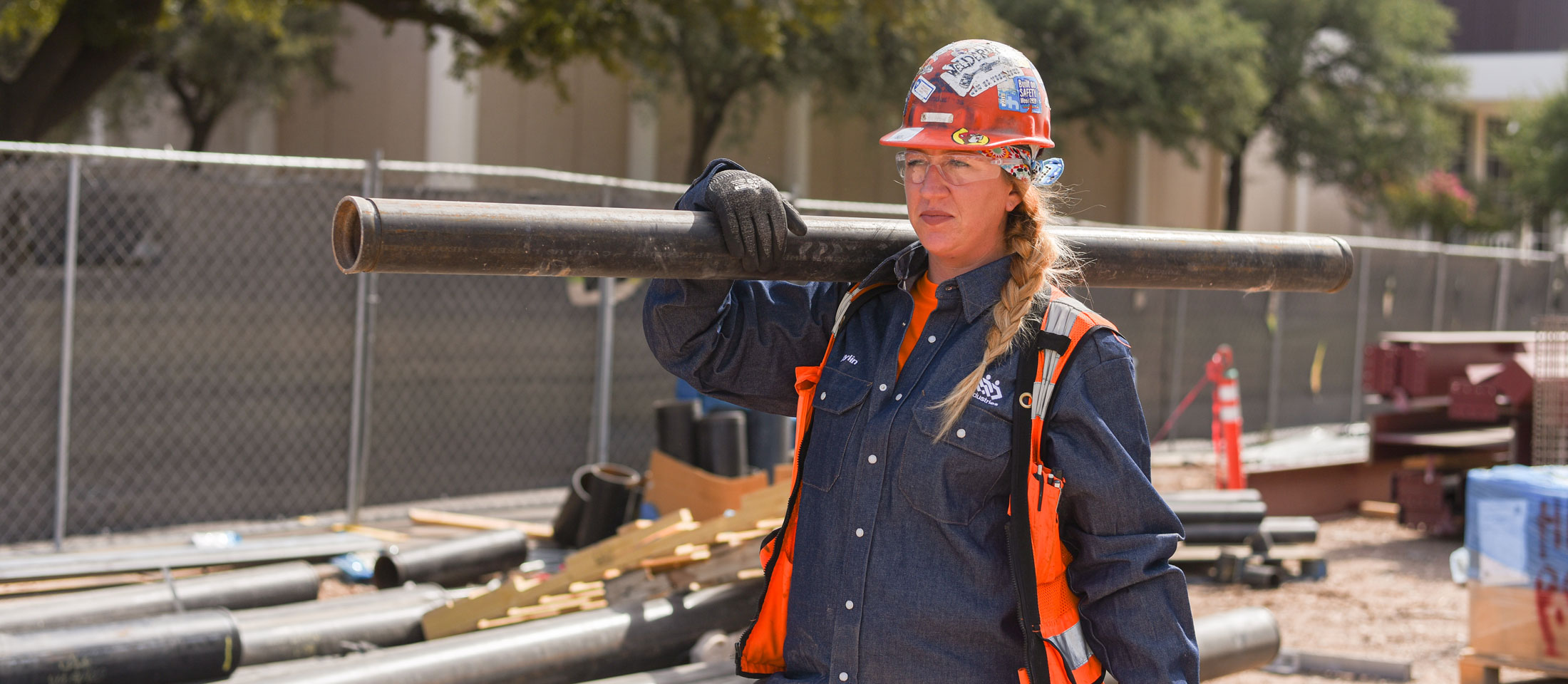 Kaylin Leas carrying a pipe.